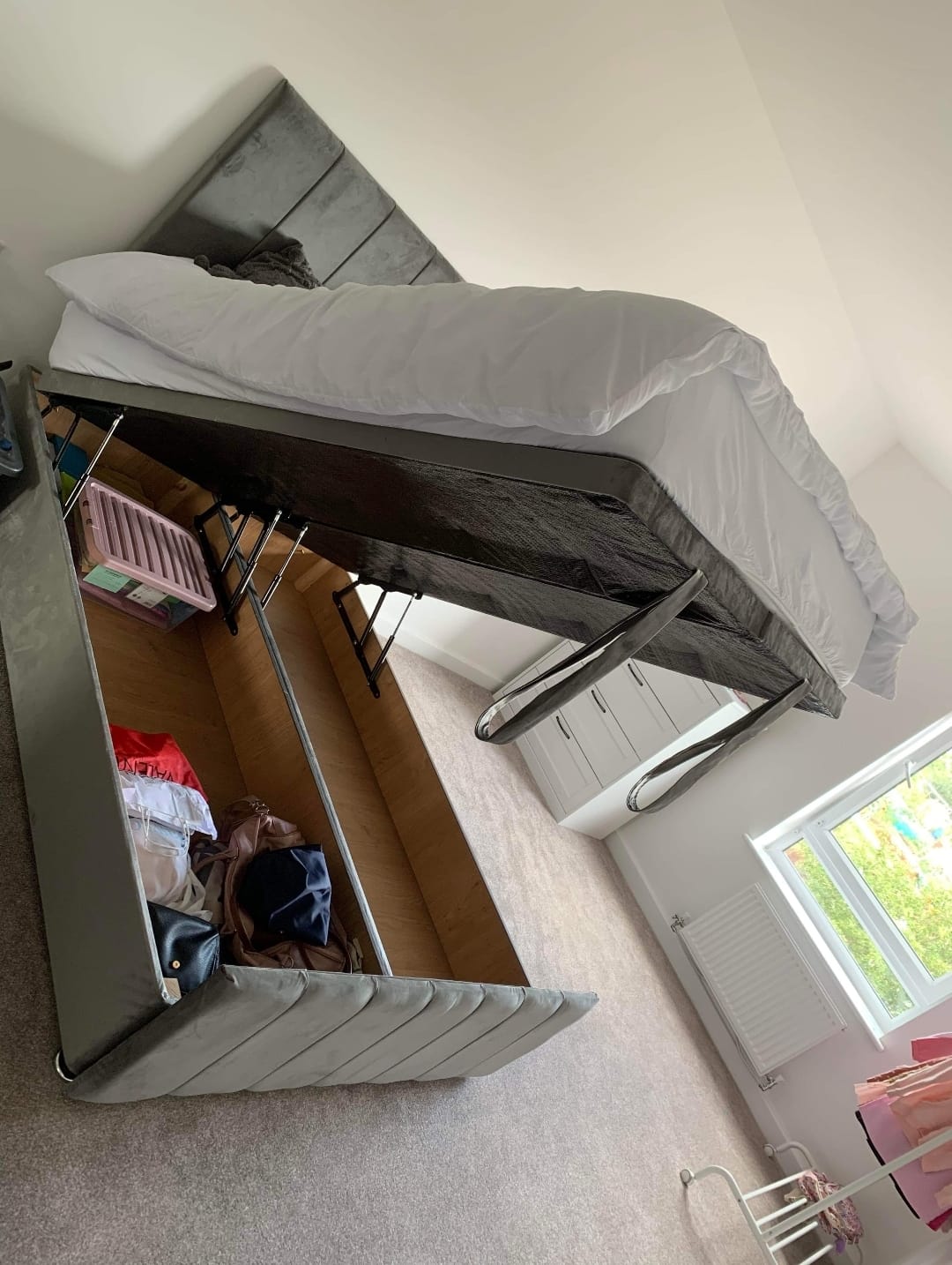 a bed with a storage box