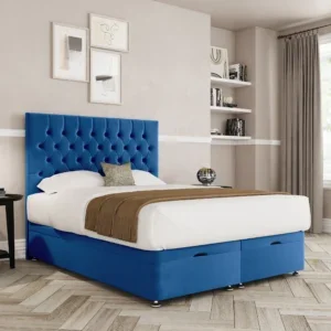 a blue bed with a brown and white headboard