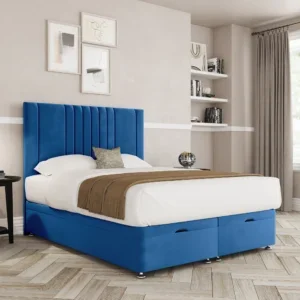 a blue and white bed in a room