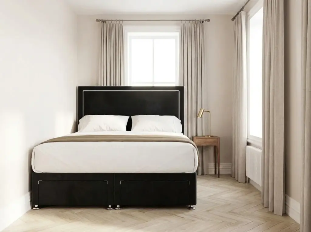 Super king bed placed against the window wall of a compact bedroom